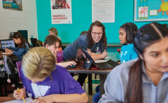 Lead Teacher helps students with homework