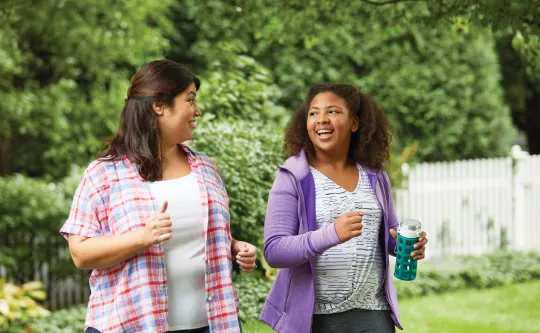 Mom and Daughter walking outside